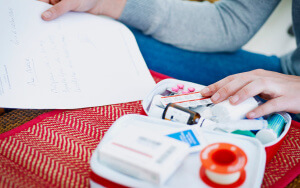 Woman preparing her first aid kit. (Photo by: BSIP/UIG via Getty Images)